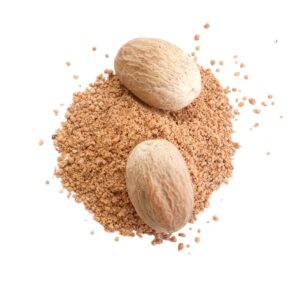 Whole nutmeg on nutmeg powder